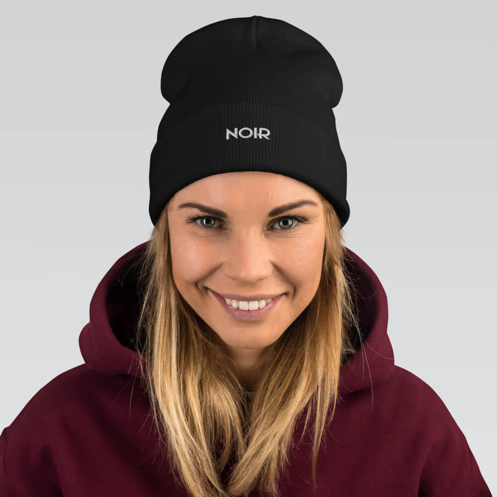 aequel film noir noir beanie logo black front woman smiling