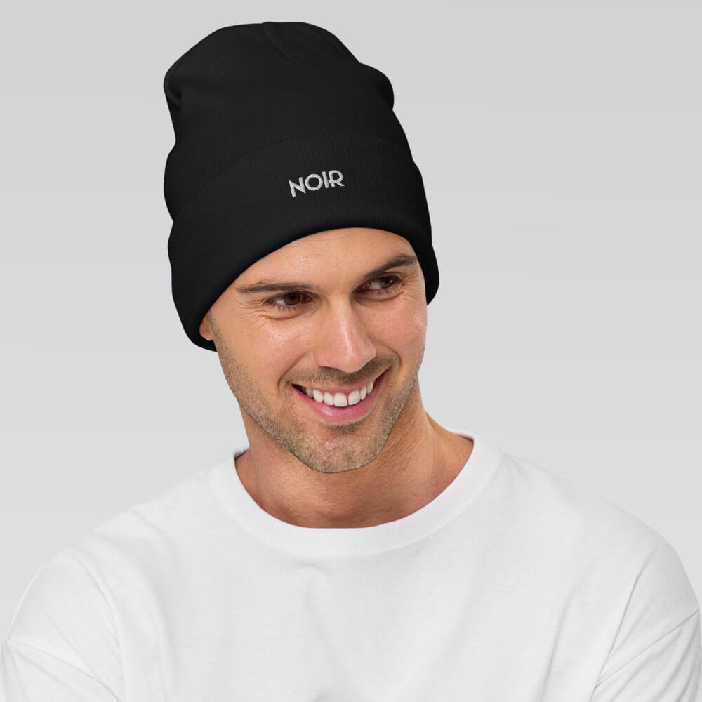 aequel film noir noir beanie logo black front man smiling