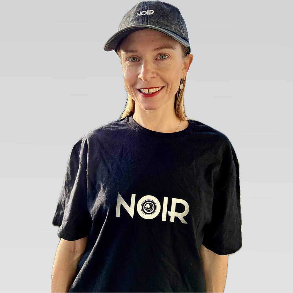 aequel film noir noir t-shirt black front woman smiling cap